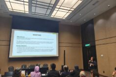 Dr. Kanokwan Suwannarong presenting the IHDILL Project objectives at NCA2026 in Kuala Lumpur, Malaysia